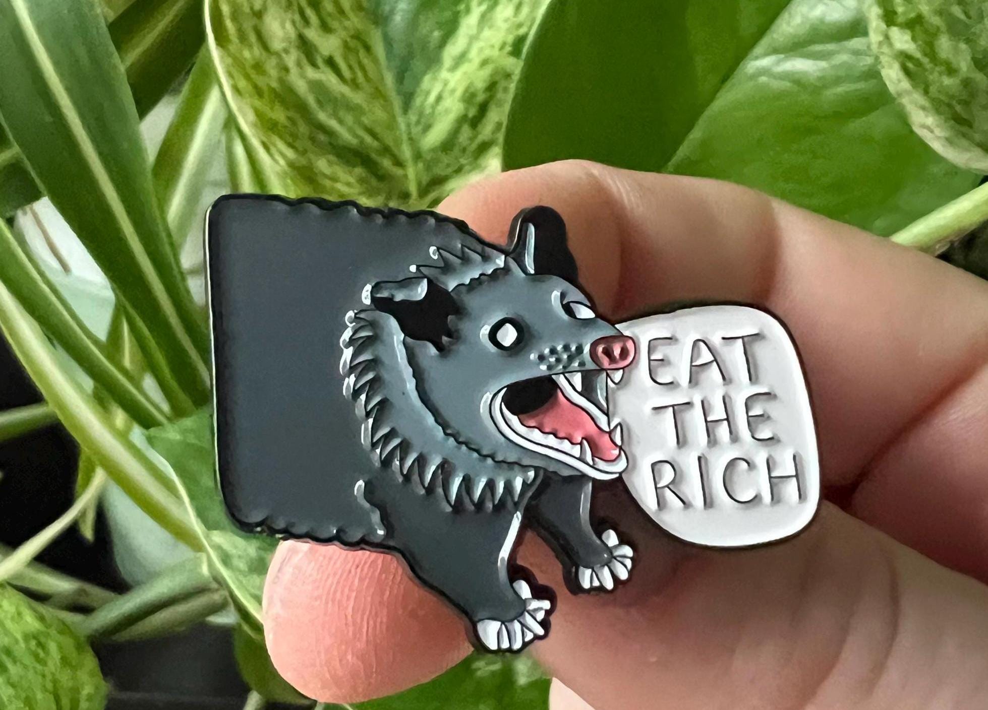 eat the rich screaming possum enamel pin